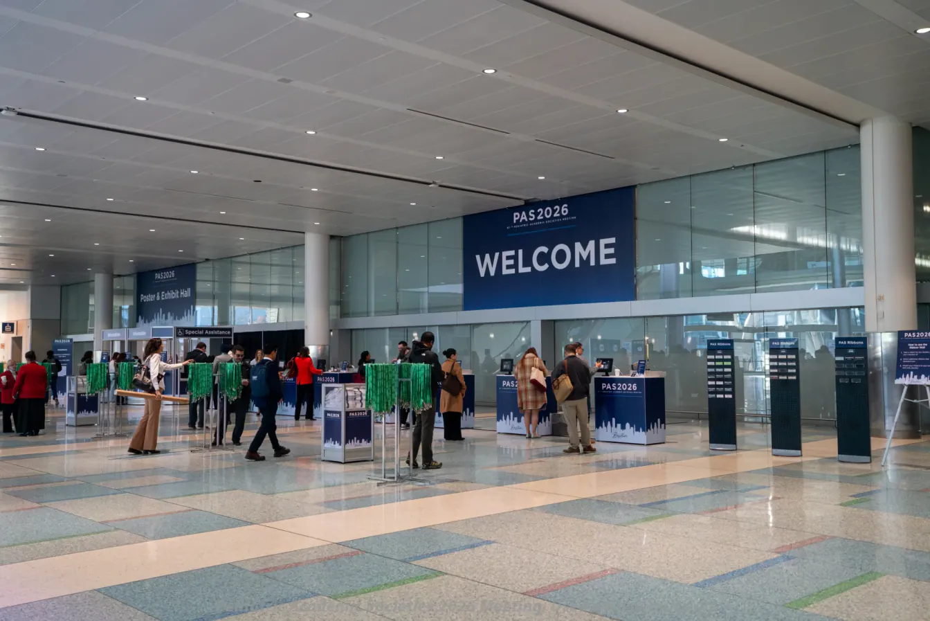Registration desks under the PAS 2026 Welcome banner at the Pediatric Academic Societies Meeting in Boston
