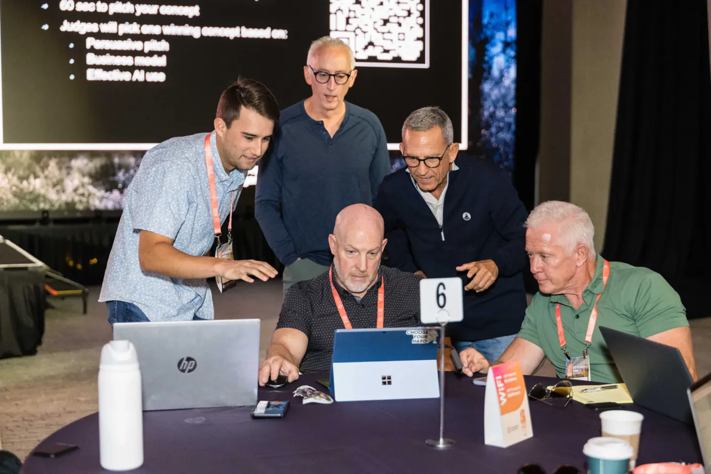 Attendees working a pitch challenge at EO Alchemy, Scottsdale, 2025