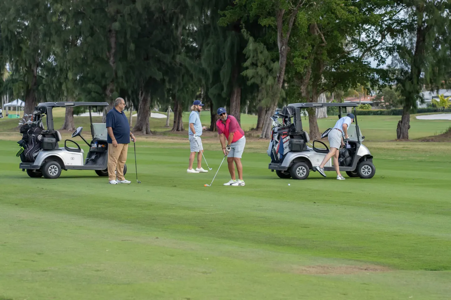 Attendees on the golf course during a conference outing