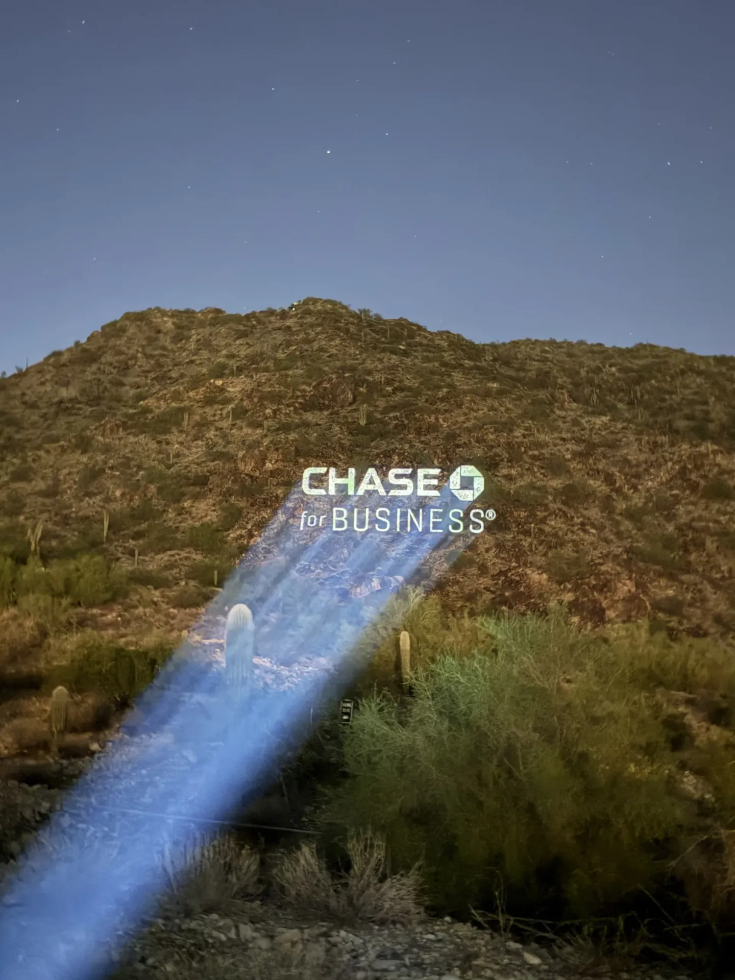 Chase for Business logo projected on a hillside at EO Alchemy, Scottsdale, 2025