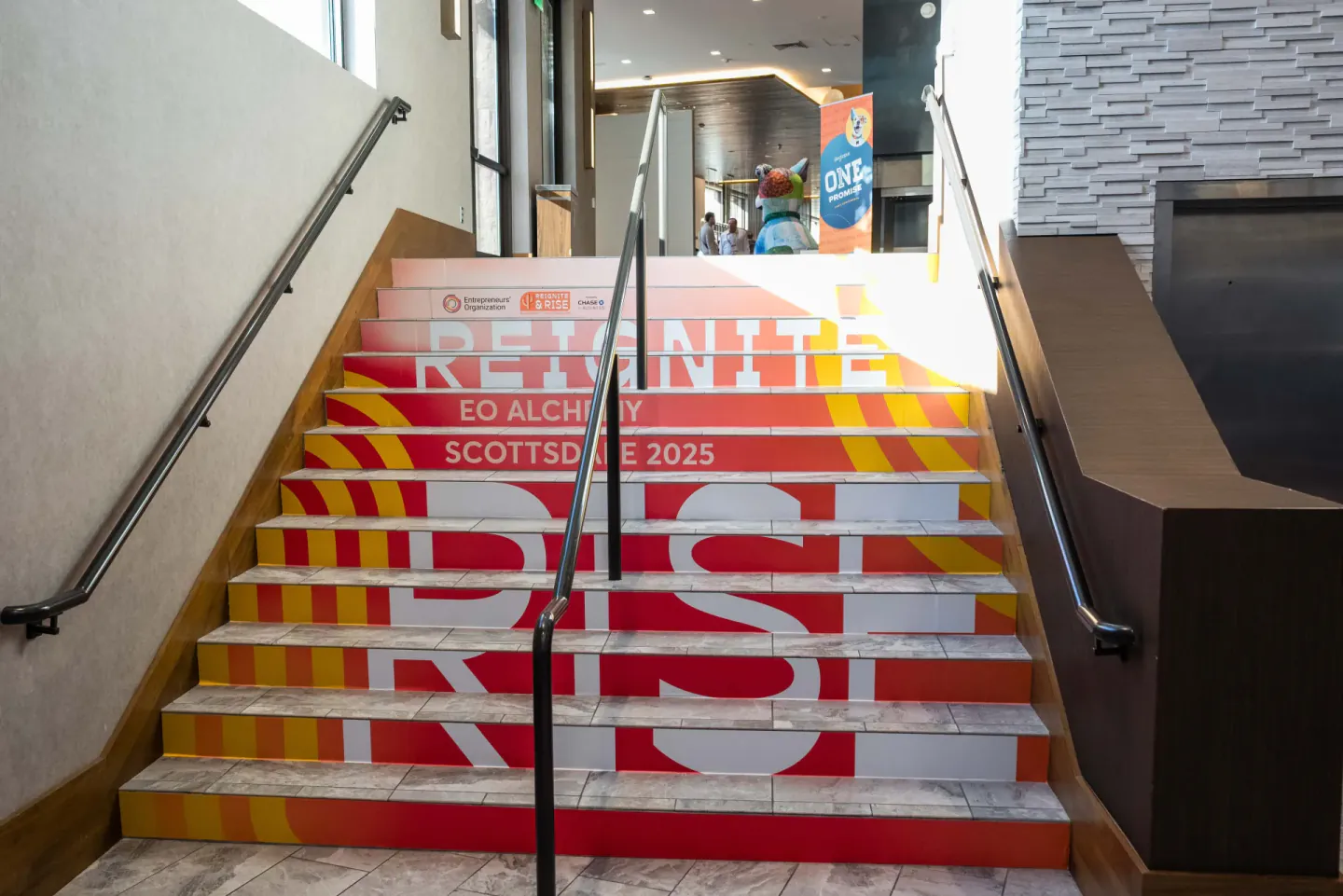 Reignite and Rise stair branding at EO Alchemy, Scottsdale, 2025