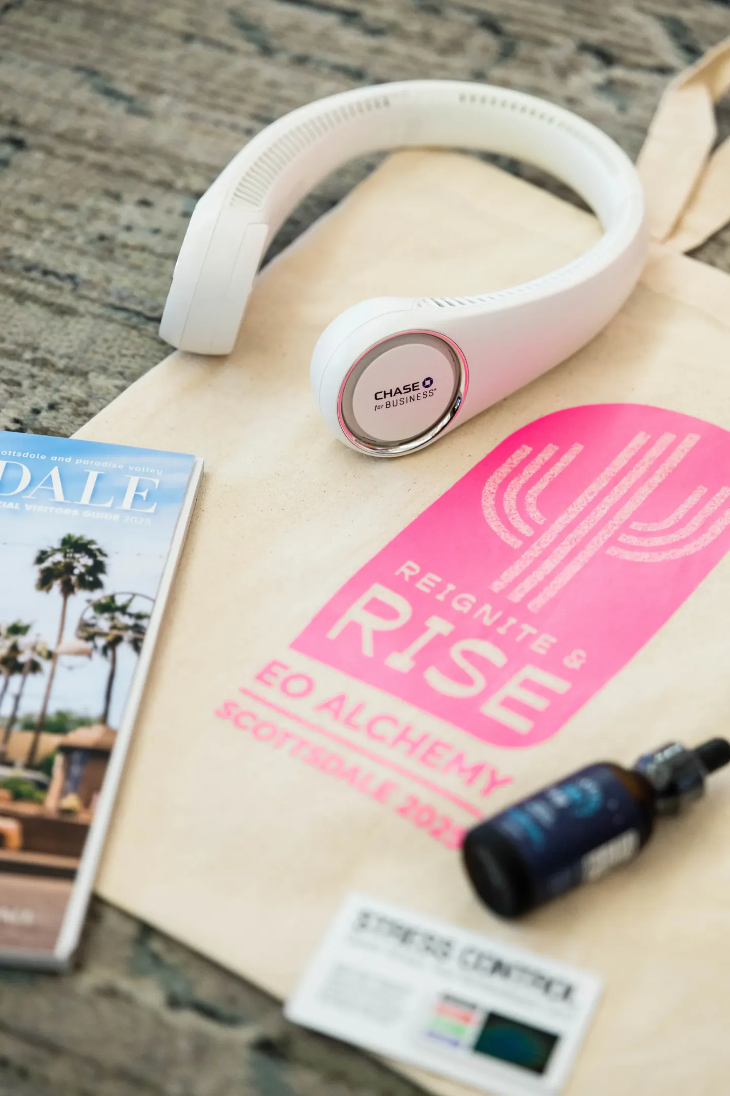 EO Alchemy attendee swag with Reignite and Rise branding, Scottsdale, 2025