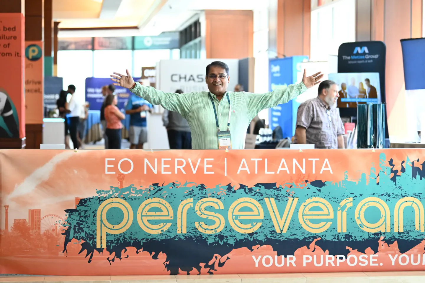 Attendee at the Perseverance banner at EO NERVE, Atlanta, 2024