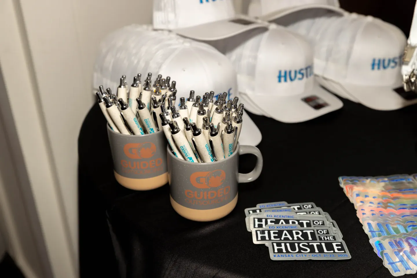 Heart of the Hustle branded swag at EO XCentric, Kansas City, 2025