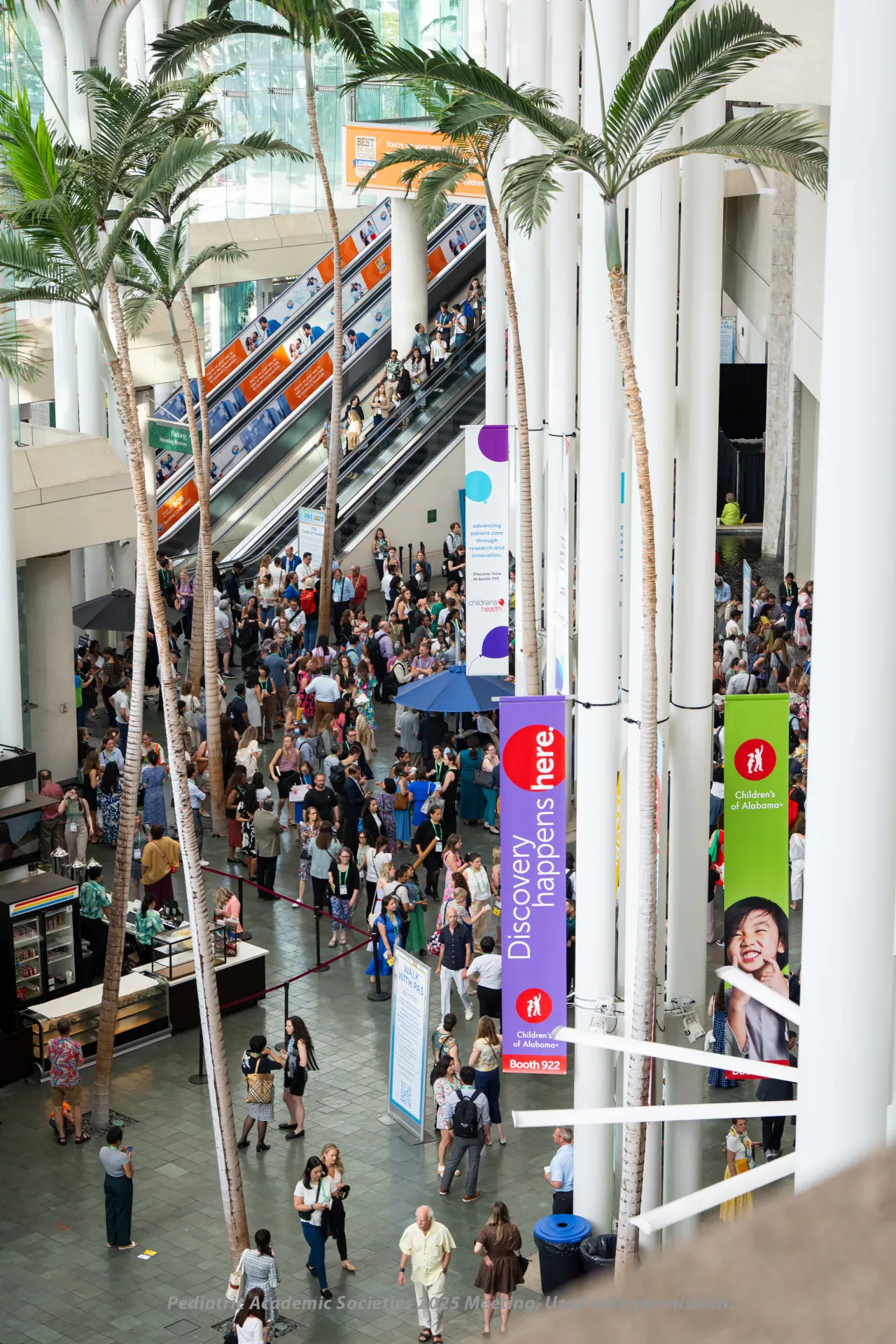Sponsor column banners in the atrium at PAS 2025, Honolulu