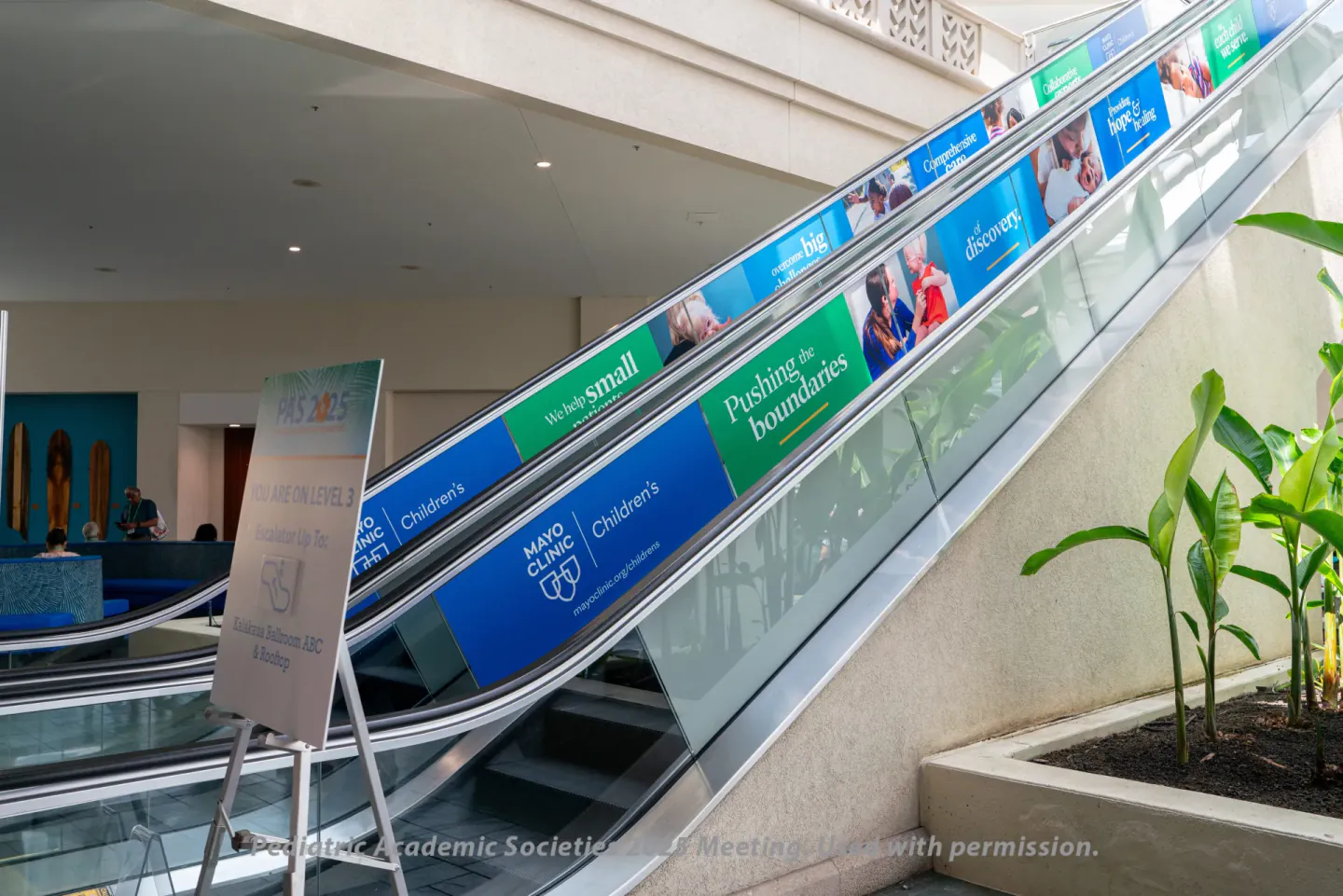Sponsor escalator graphics at PAS 2025, Honolulu