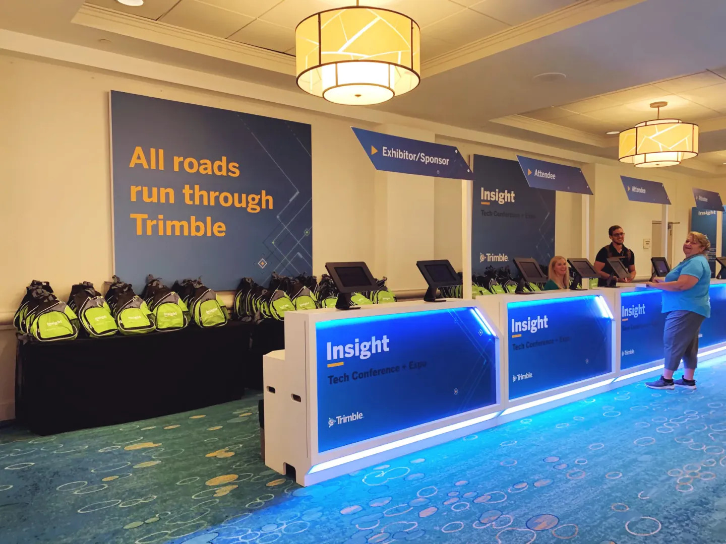 Branded Insight registration desk and tote wall, Orlando, 2022