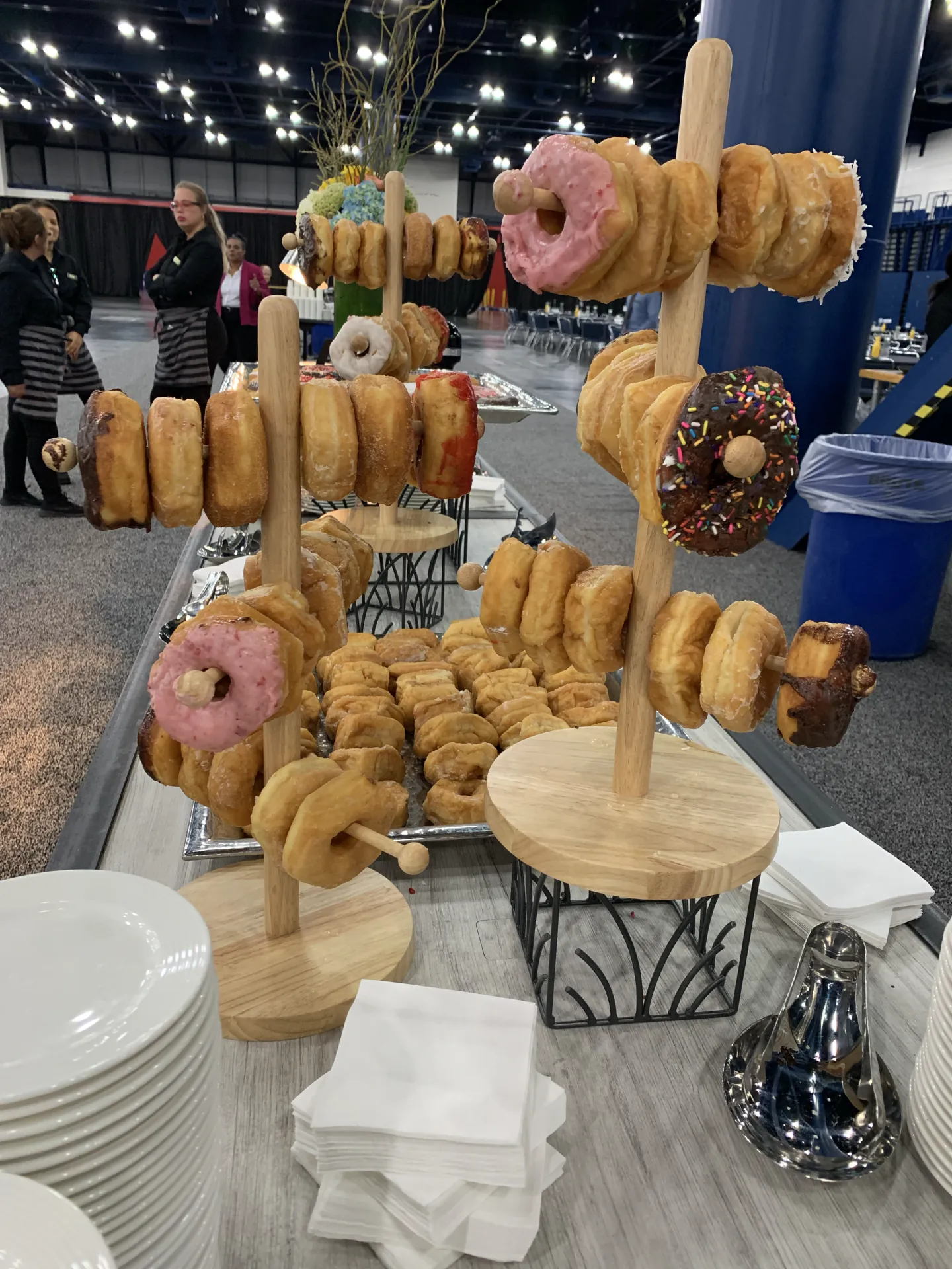 Donut display on wooden dowels at a morning break