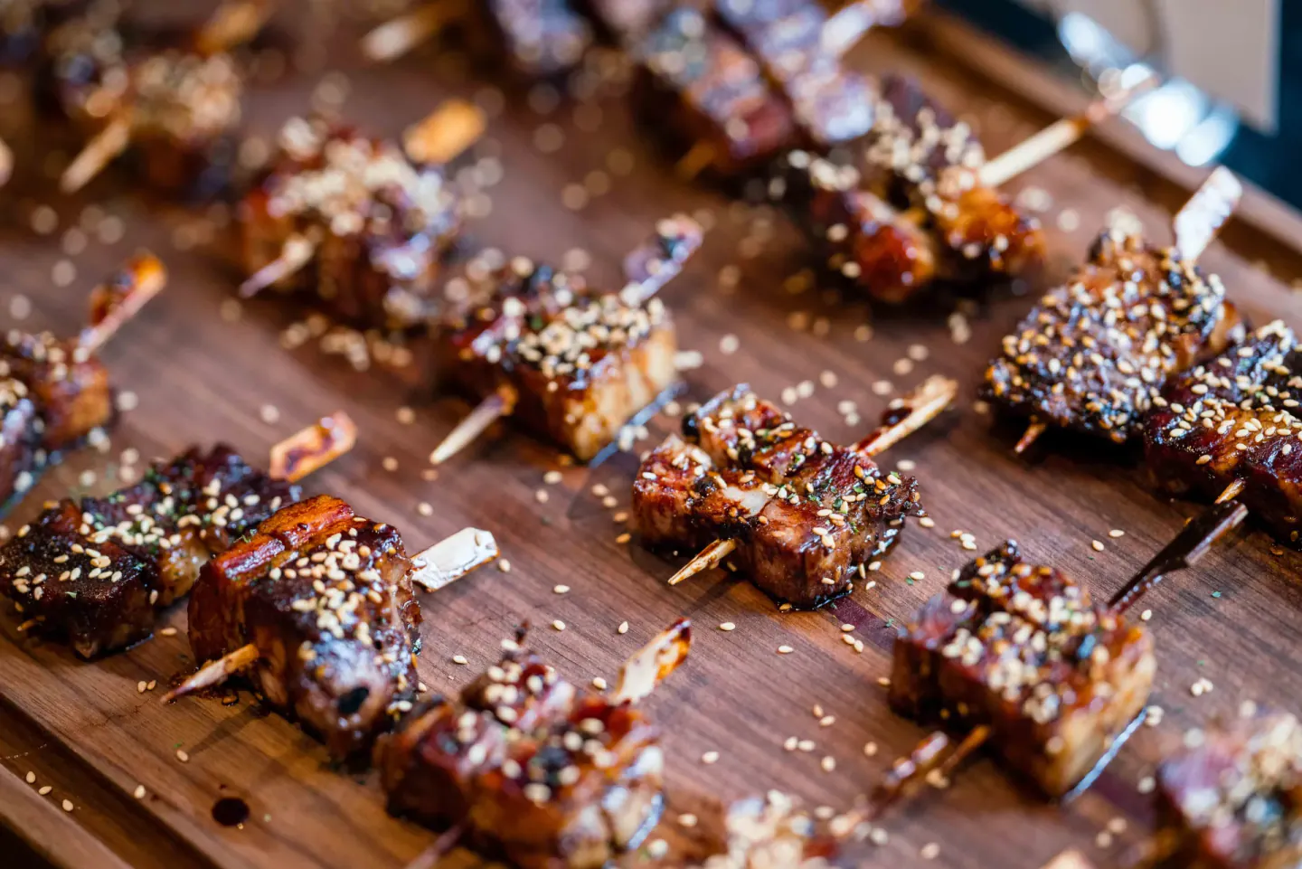 Glazed skewers on a wooden board at EO Alchemy, Scottsdale, 2025