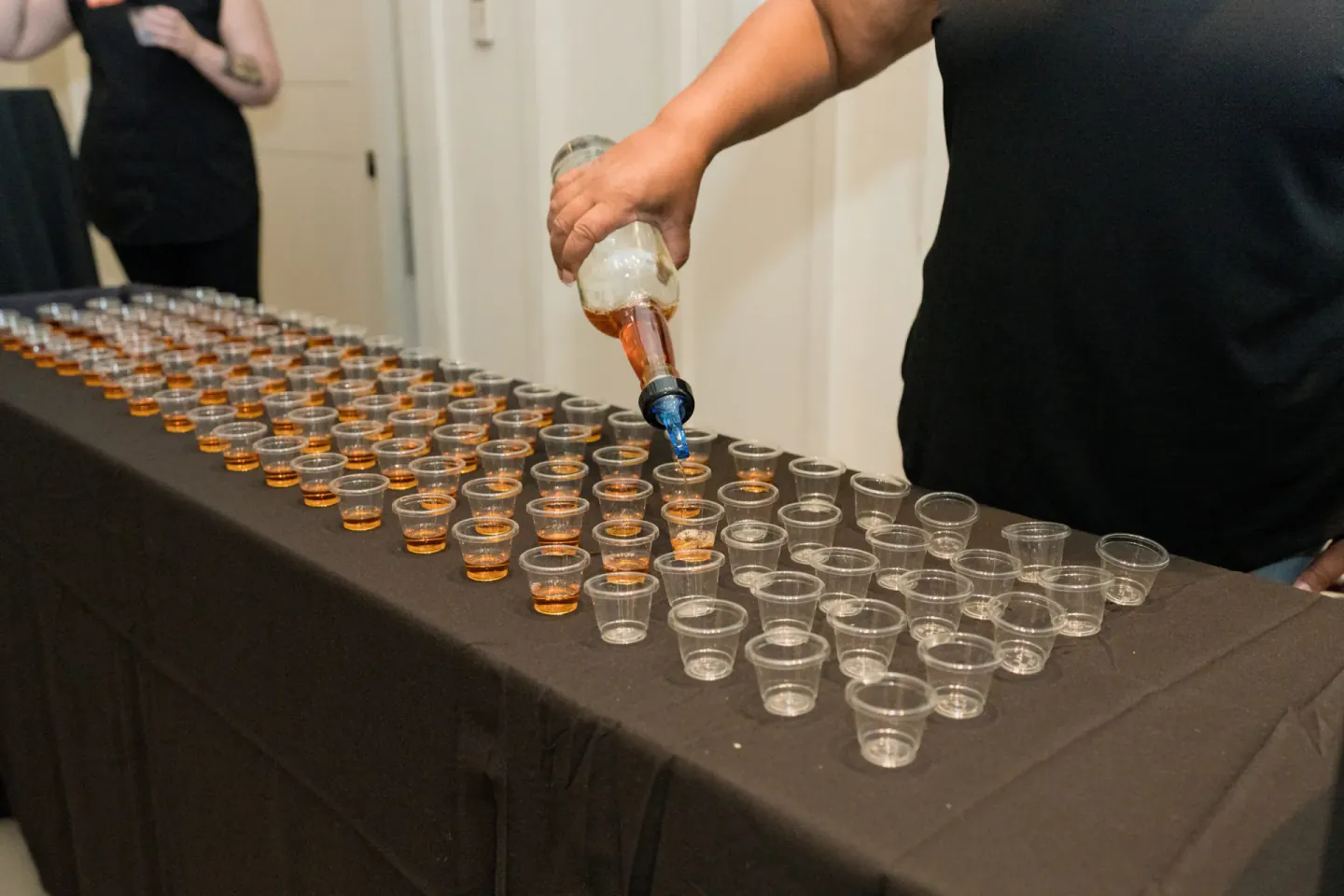 Bourbon tasting pours lined up at EO XCentric, Cincinnati, 2022