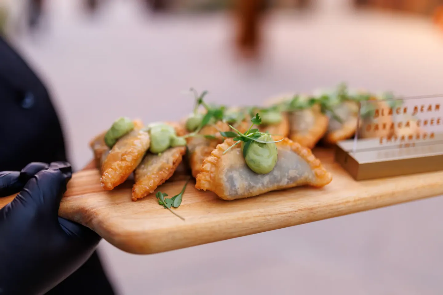 Black bean and Oaxaca cheese empanadas passed at EO XCentric, Fort Worth, 2024
