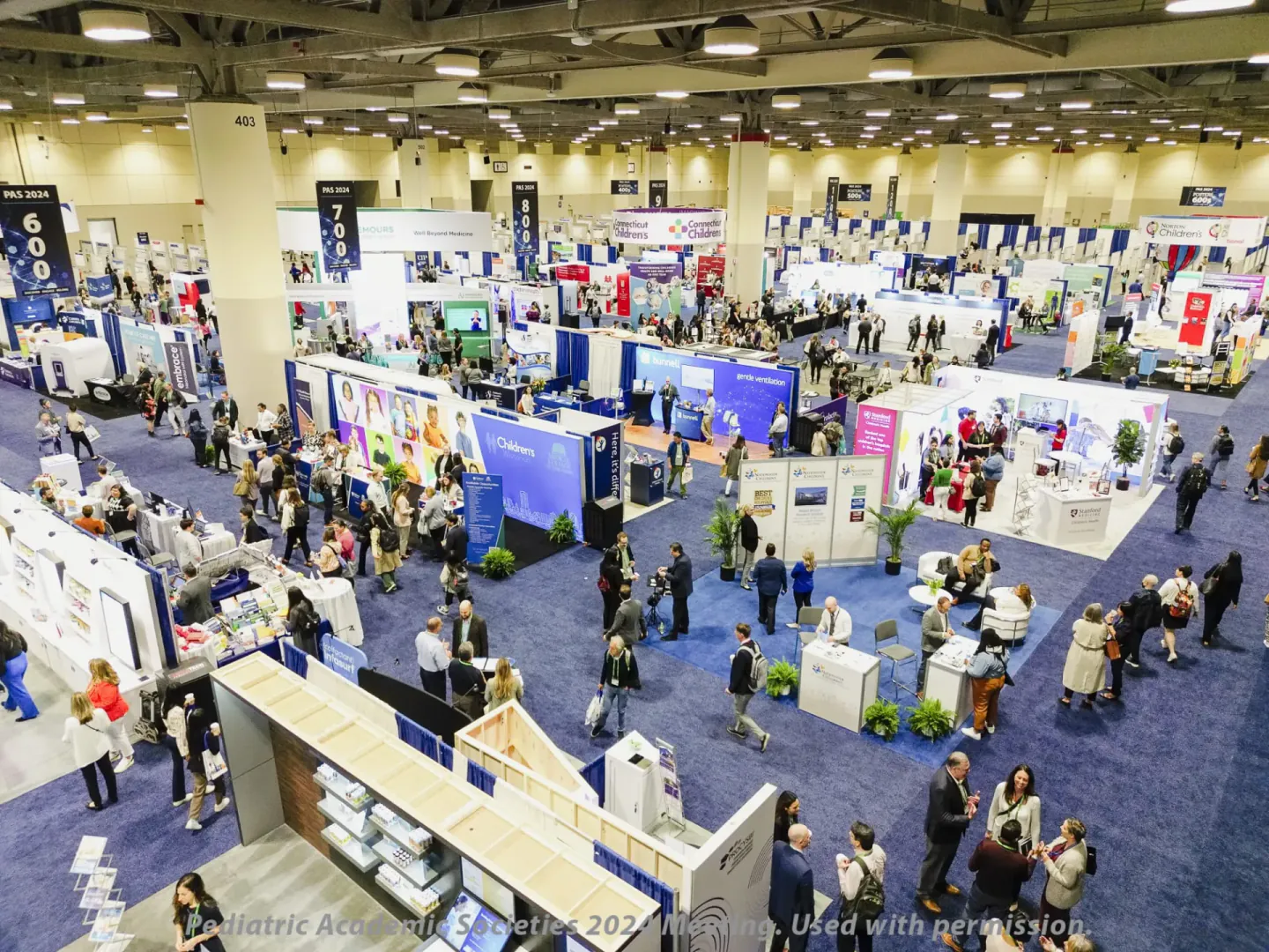 Overhead view of the exhibit hall at PAS 2024, Toronto