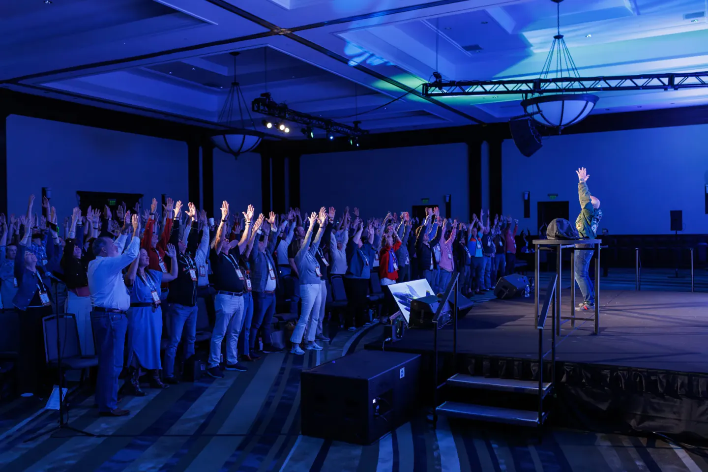 Audience standing with the speaker at EO XCentric, Fort Worth, 2024