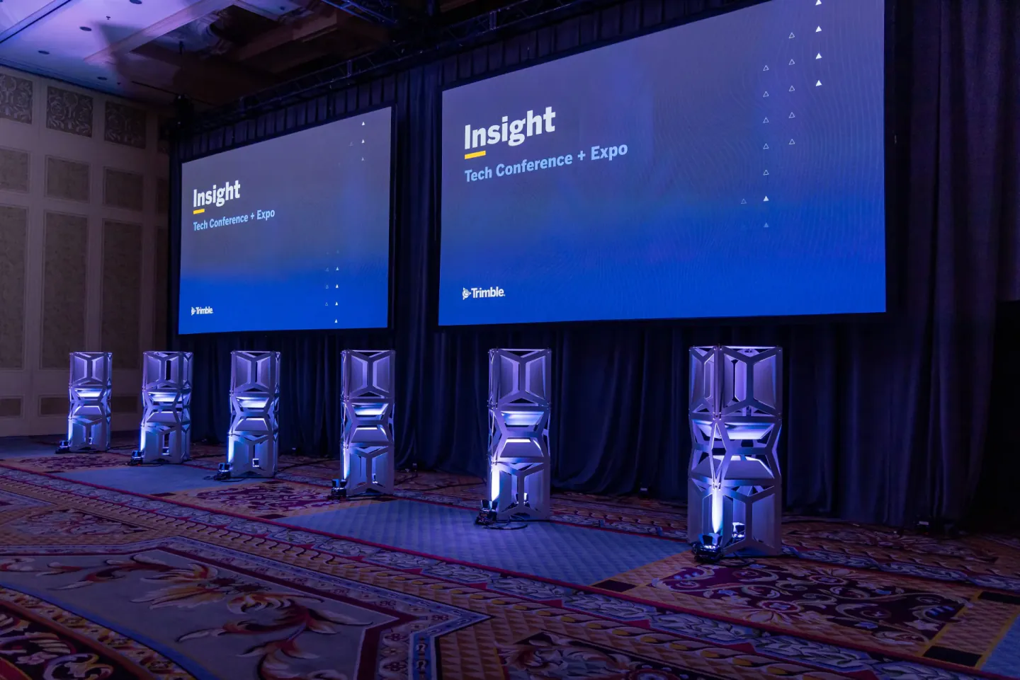 Dual screens and scenic elements before a Trimble Insight session, Las Vegas, 2024