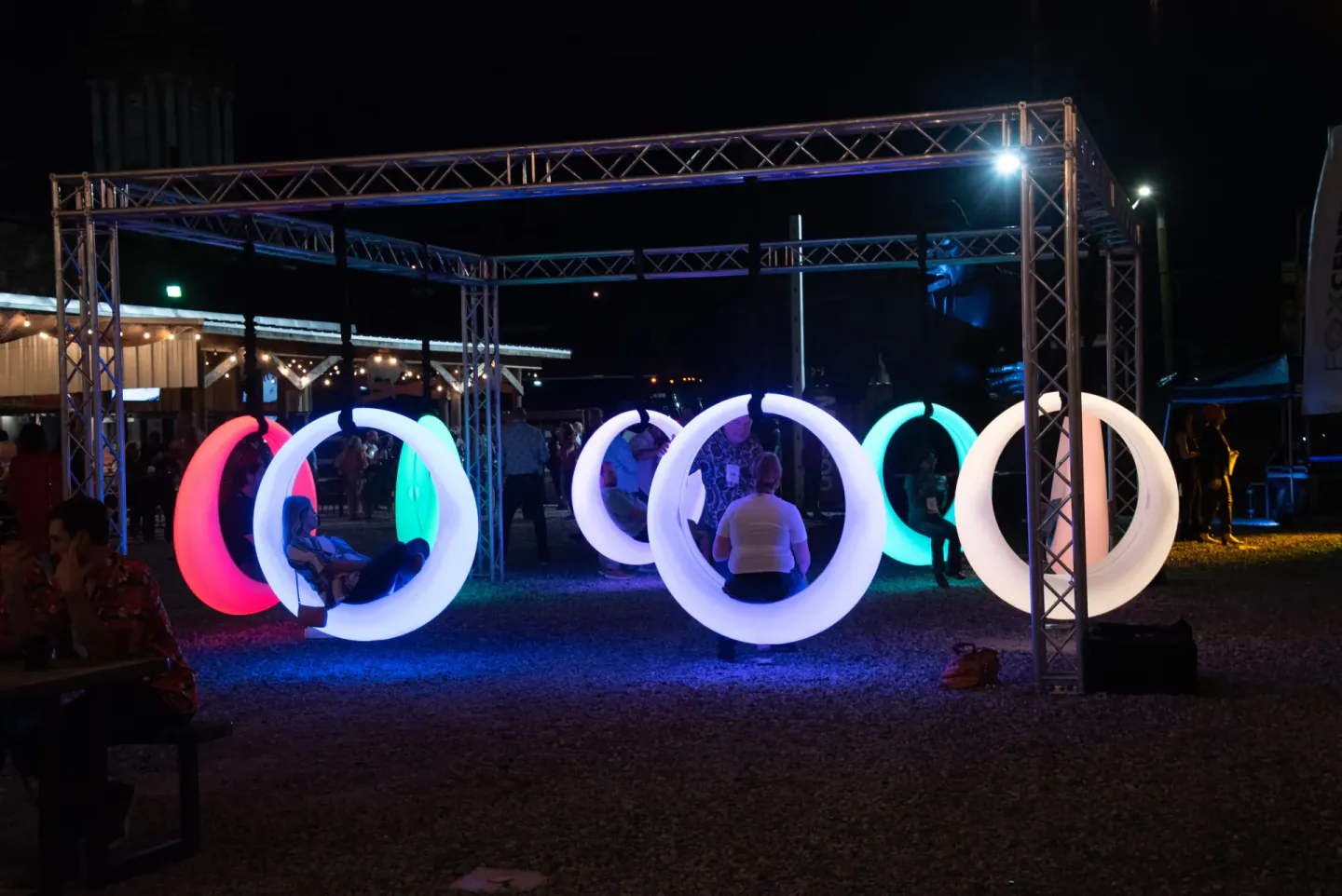 Glowing swing seating at an evening event