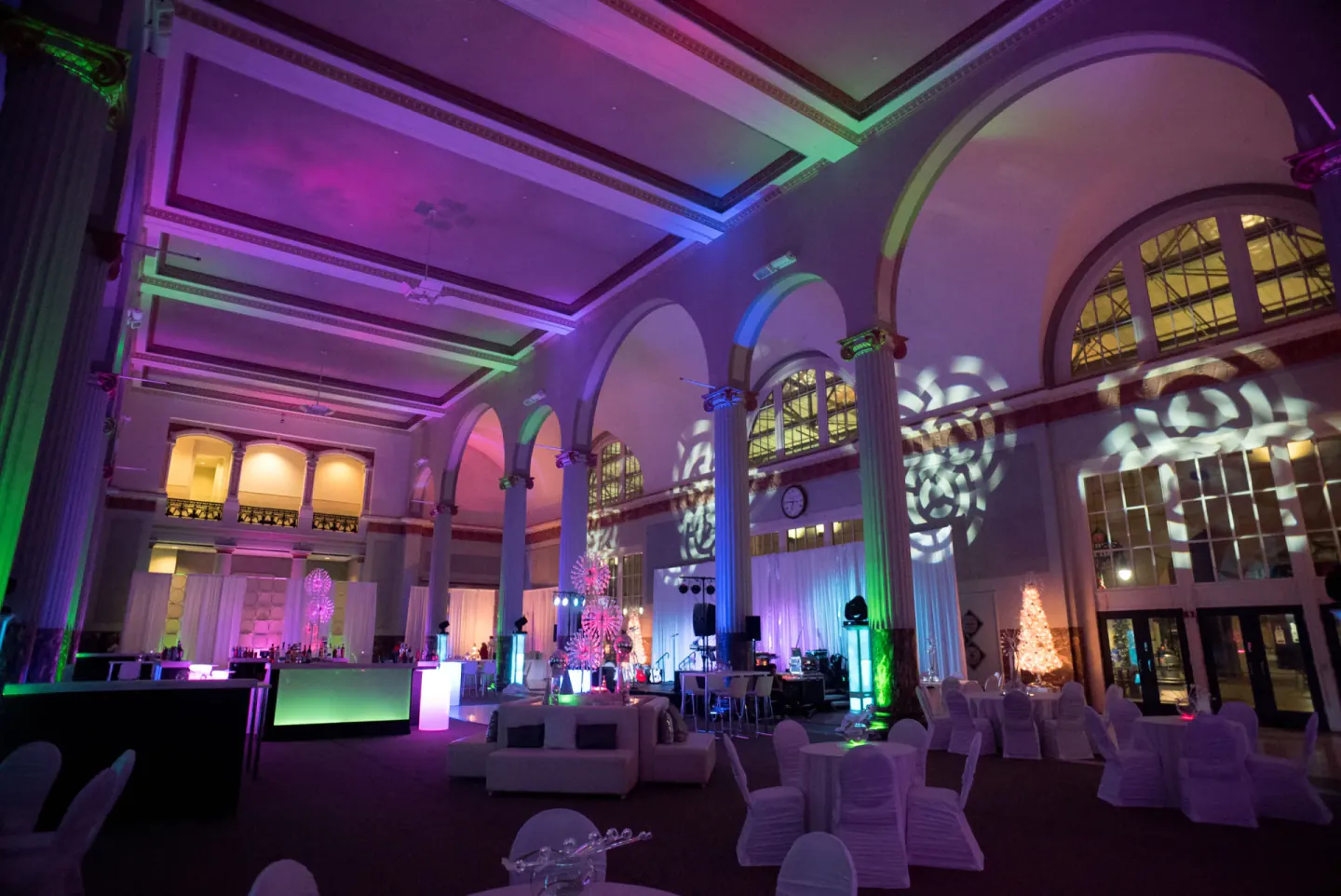 Uplit historic grand hall set for a reception