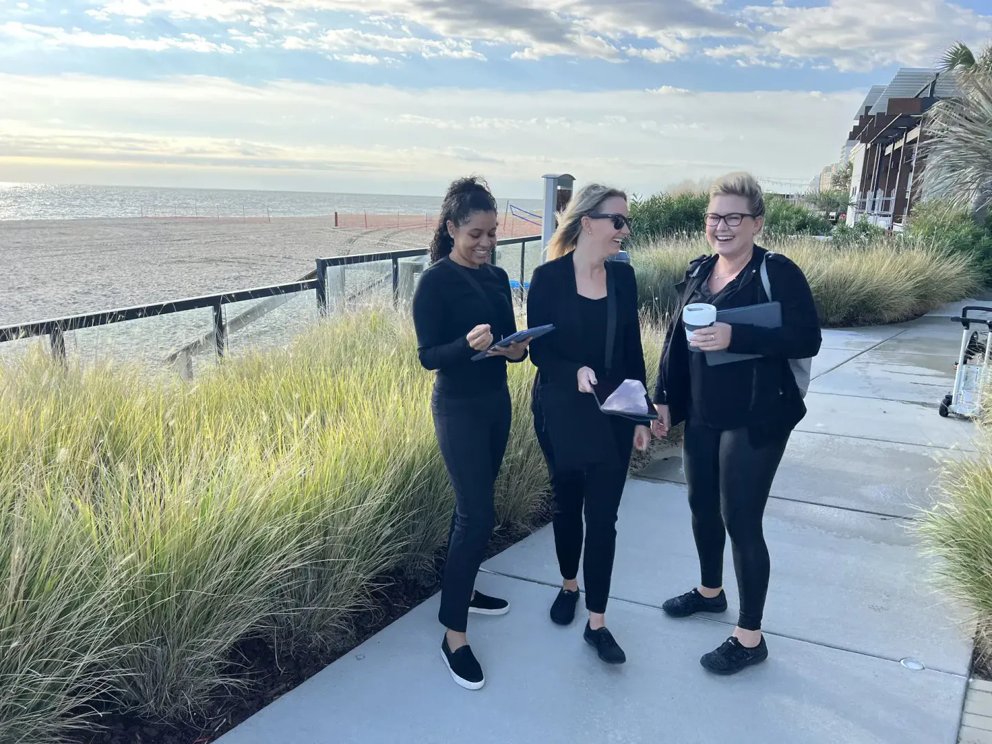 On-site team on the boardwalk with clipboards at EO NERVE, Virginia Beach, 2022
