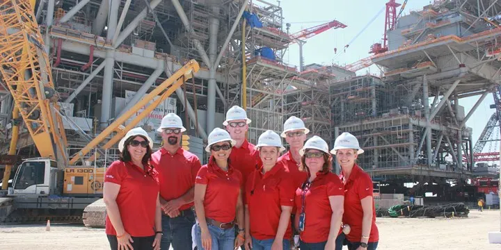 On-site team in hard hats at the Noble Energy Leviathan platform tour near Houston