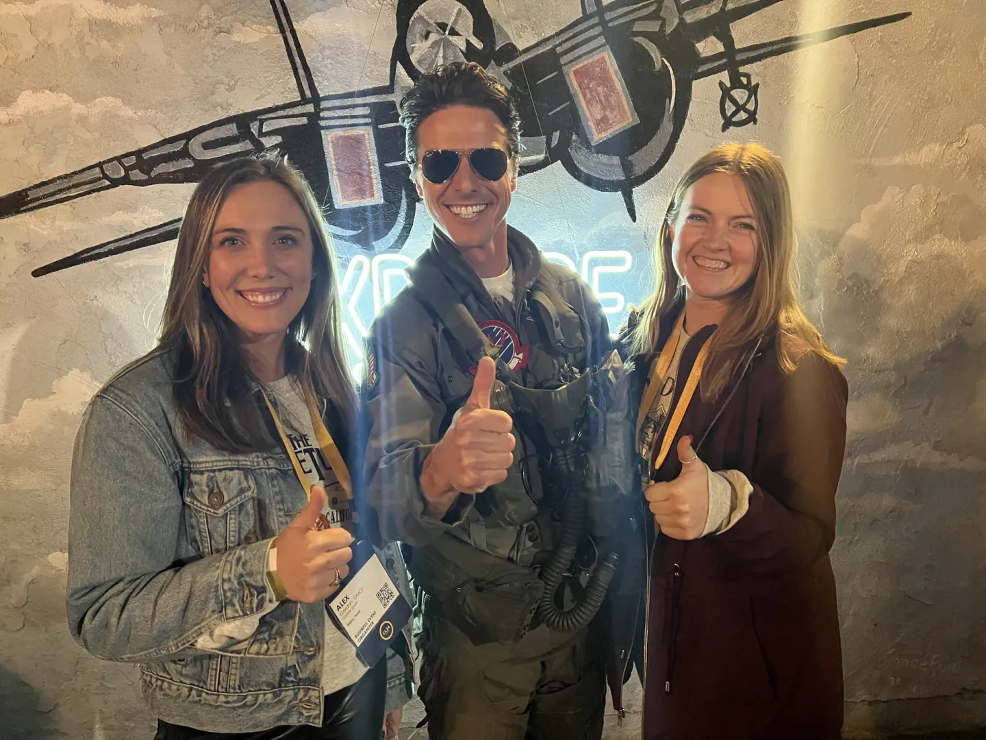 On-site staff with a Top Gun lookalike at an evening event