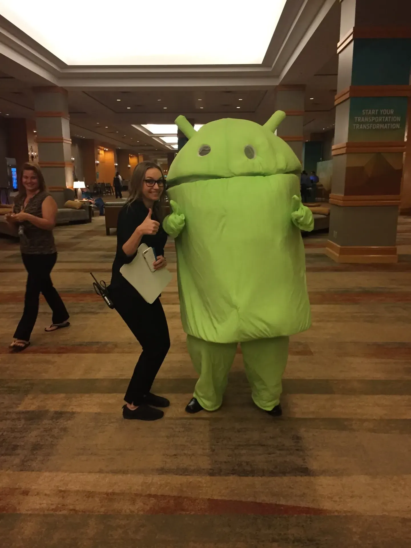 On-site staff with the Android mascot at TMW Transforum