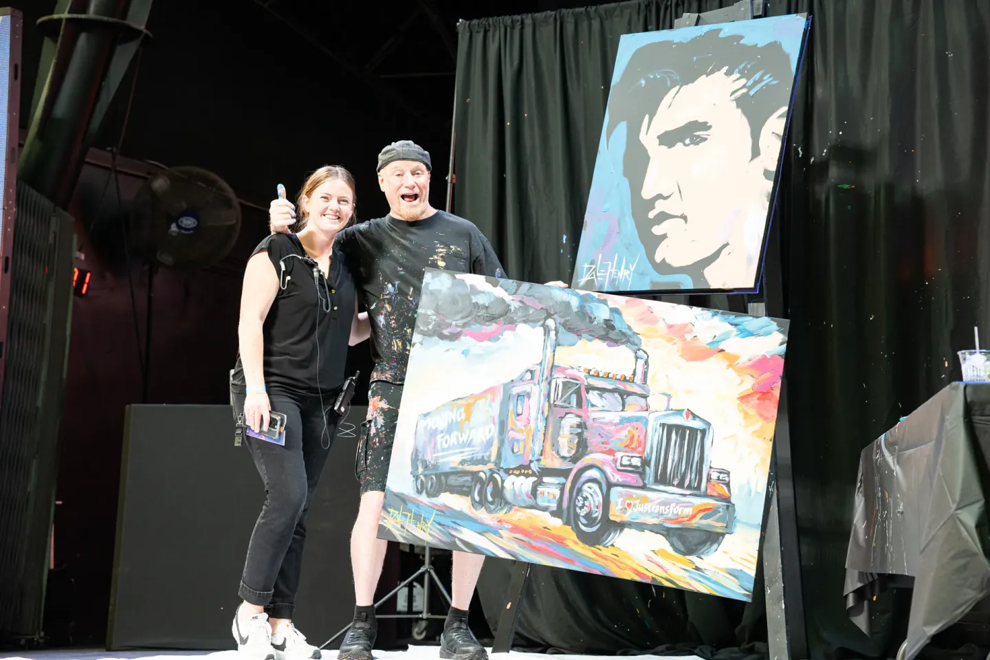 On-site staff with a live painter on stage at Trimble Insight, Las Vegas, 2024