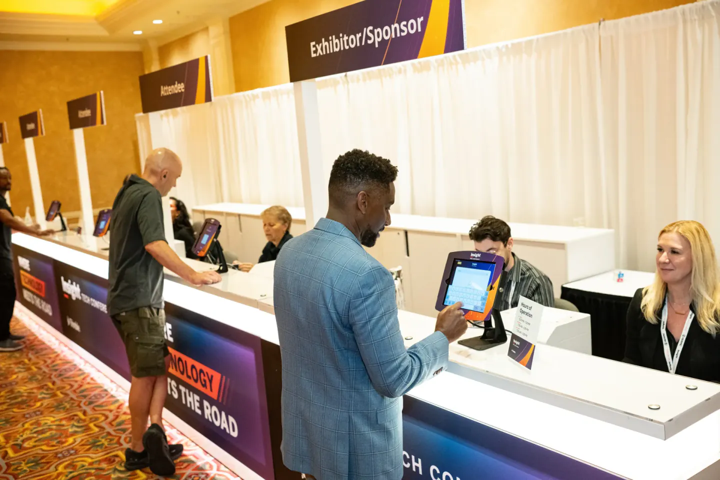 Attendee checking in at a Trimble Insight kiosk, Las Vegas, 2024